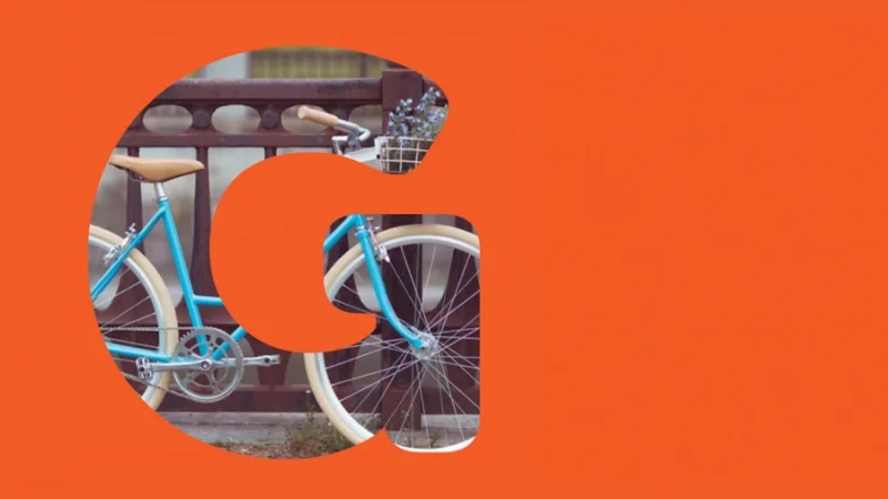 a large letter g filled with the image of a vintage bicycle in adobe illustrator
