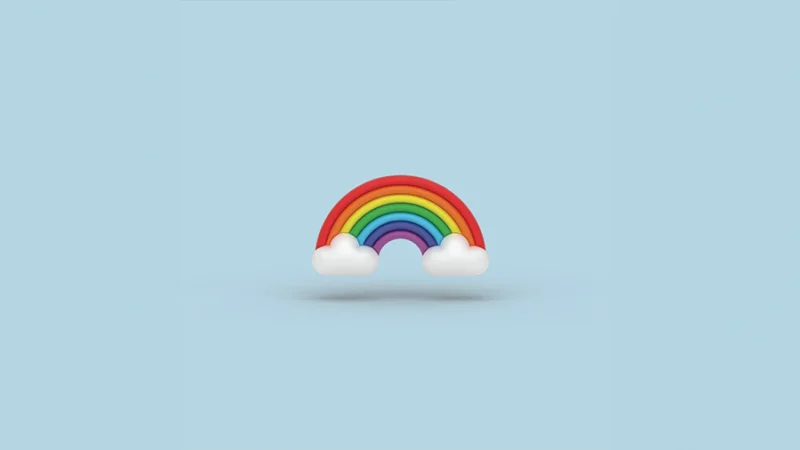 A rainbow against a light blue background